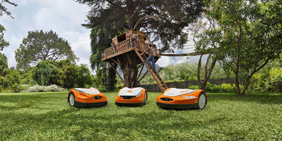 Three Lawn Mowers Are Sitting on Top of A Lush Green Lawn — Stihl Shop Grafton in Clarence Valley, NSW