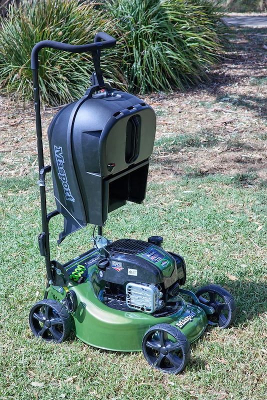 A Green Lawn Mower Is Sitting on Top of A Lush Green Lawn — Stihl Shop Grafton in Grafton, NSW