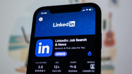 A close-up view of a smartphone screen displaying the LinkedIn app store page with an update button visible.