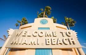 Art Deco “Welcome to Miami Beach” sign against a blue sky