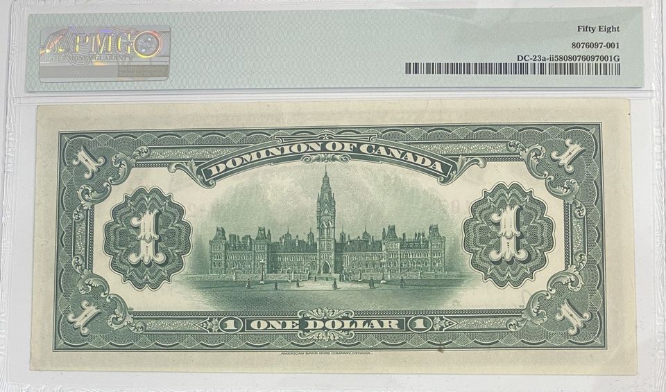 A one dollar bill is displayed in a clear case