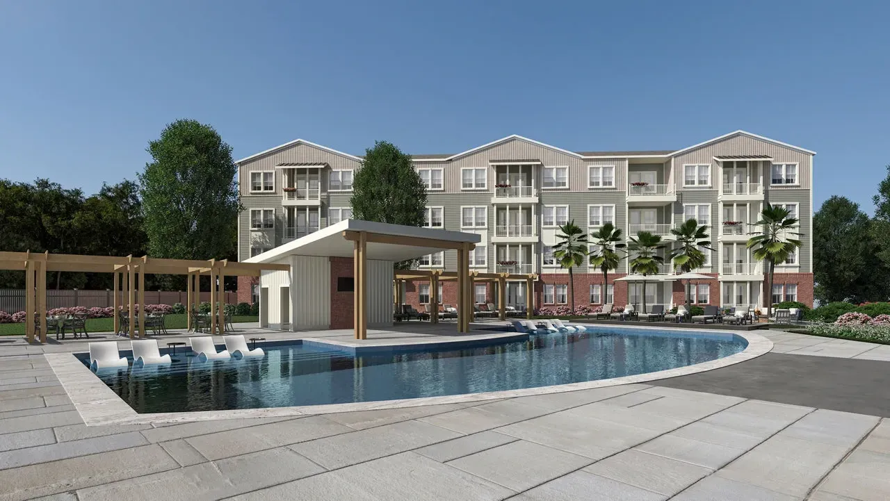Luxury apartment complex outdoor swimming pool with in-water lounge chairs and cabana.