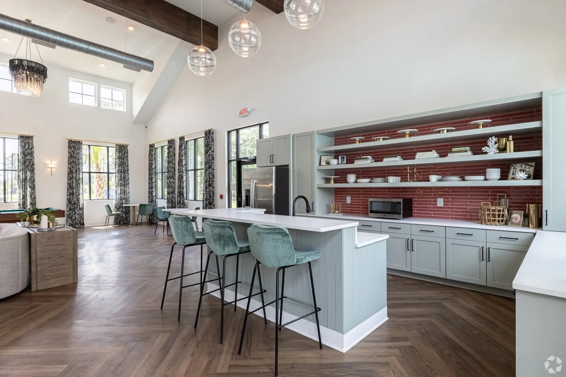Communal kitchen island with bar stools and modern cabinetry