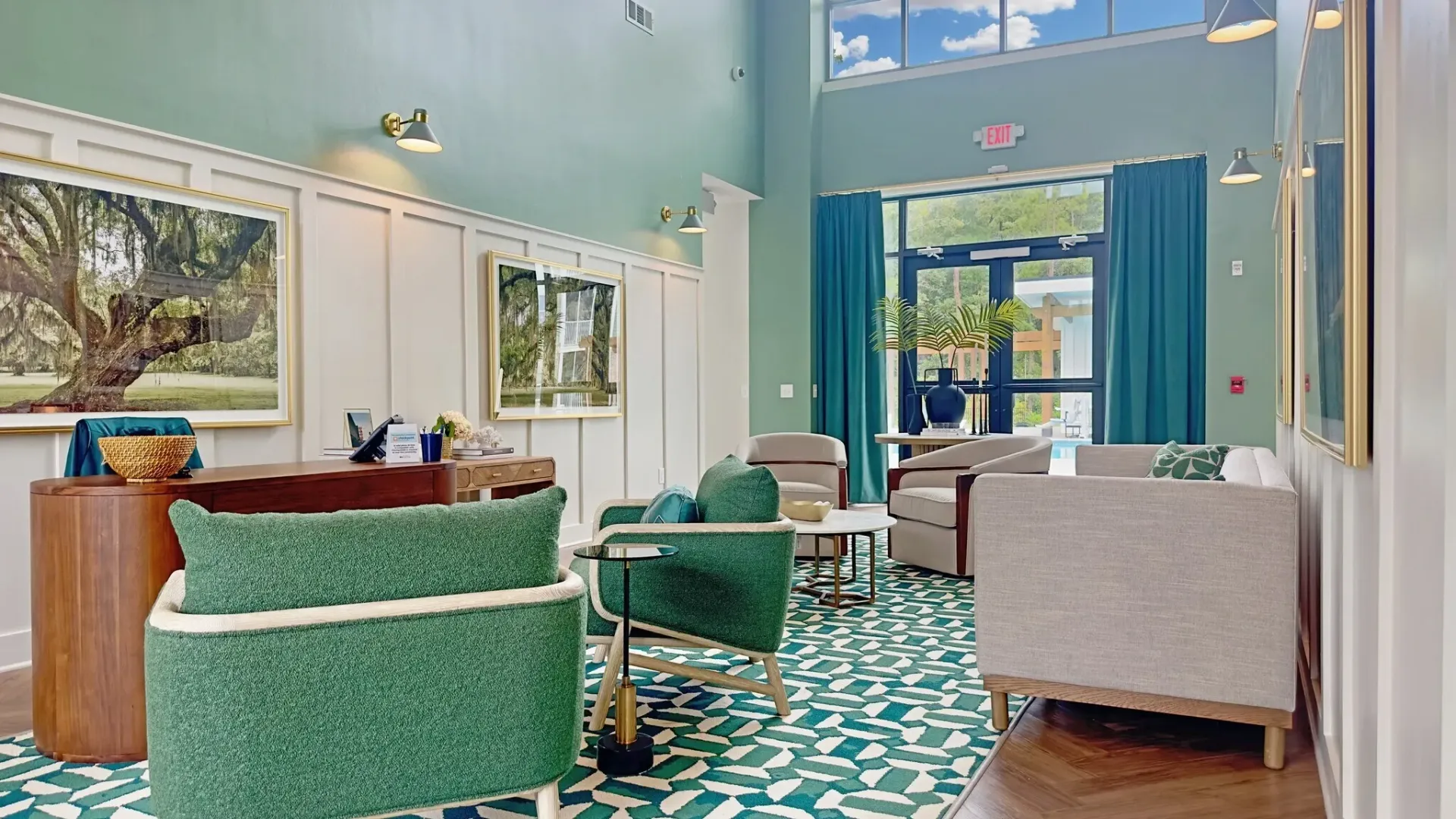 Lobby area with reception desk, seating, and artwork.