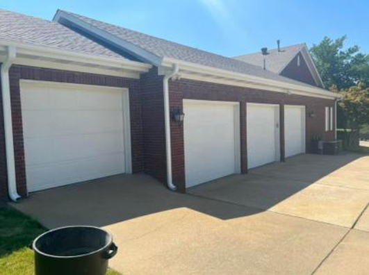 white seamless gutters and downspouts
