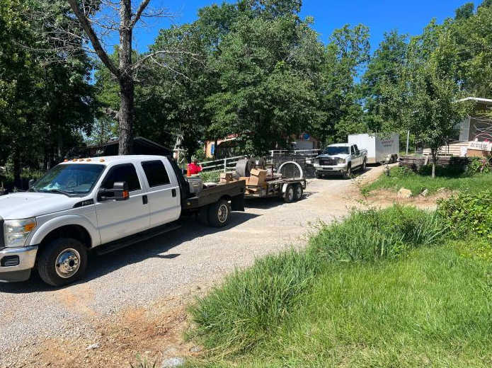 s&s siding & seamless gutters trucks on jobsite