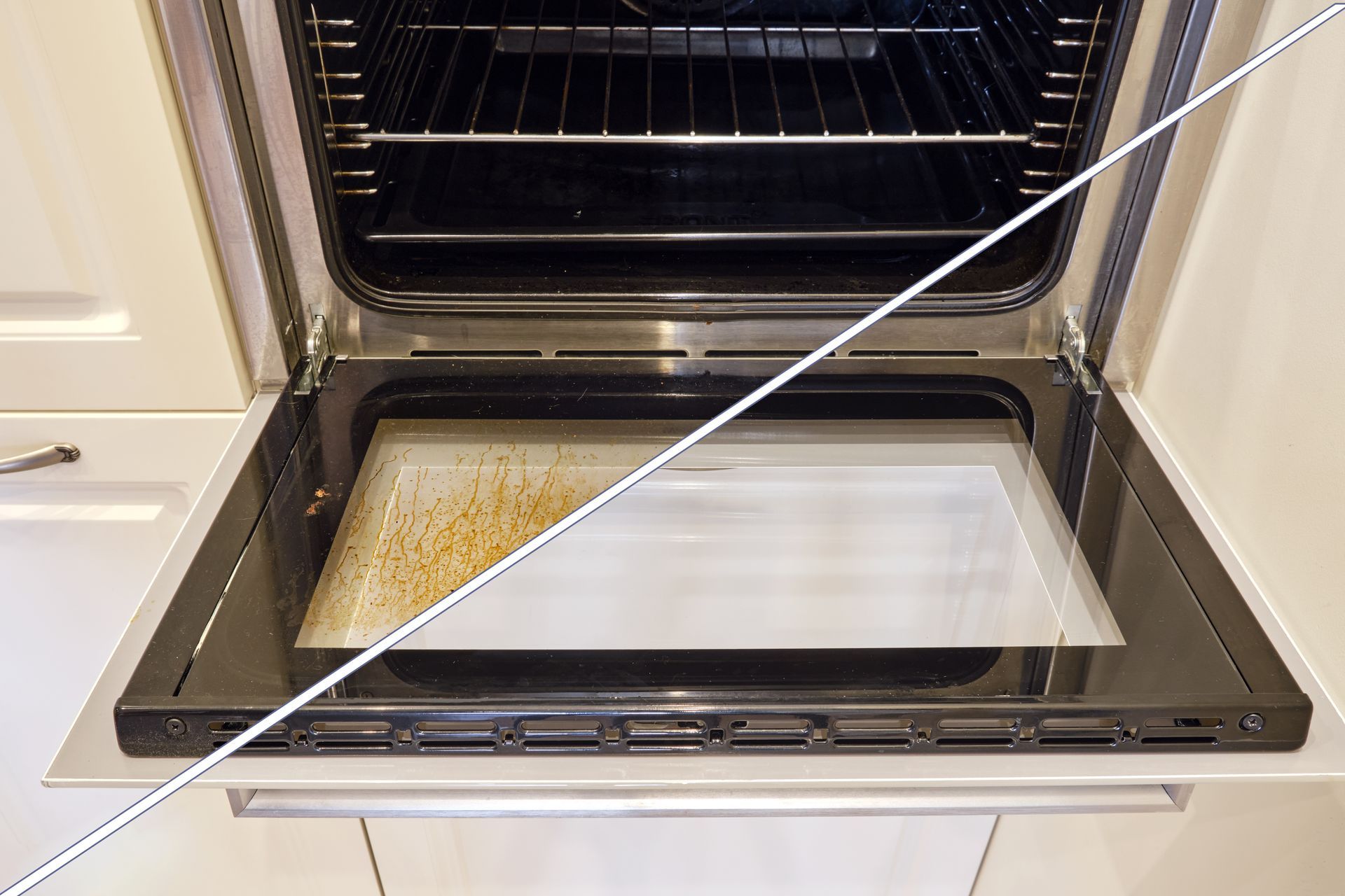 Open oven with dirty baking sheet, half-cleaned.