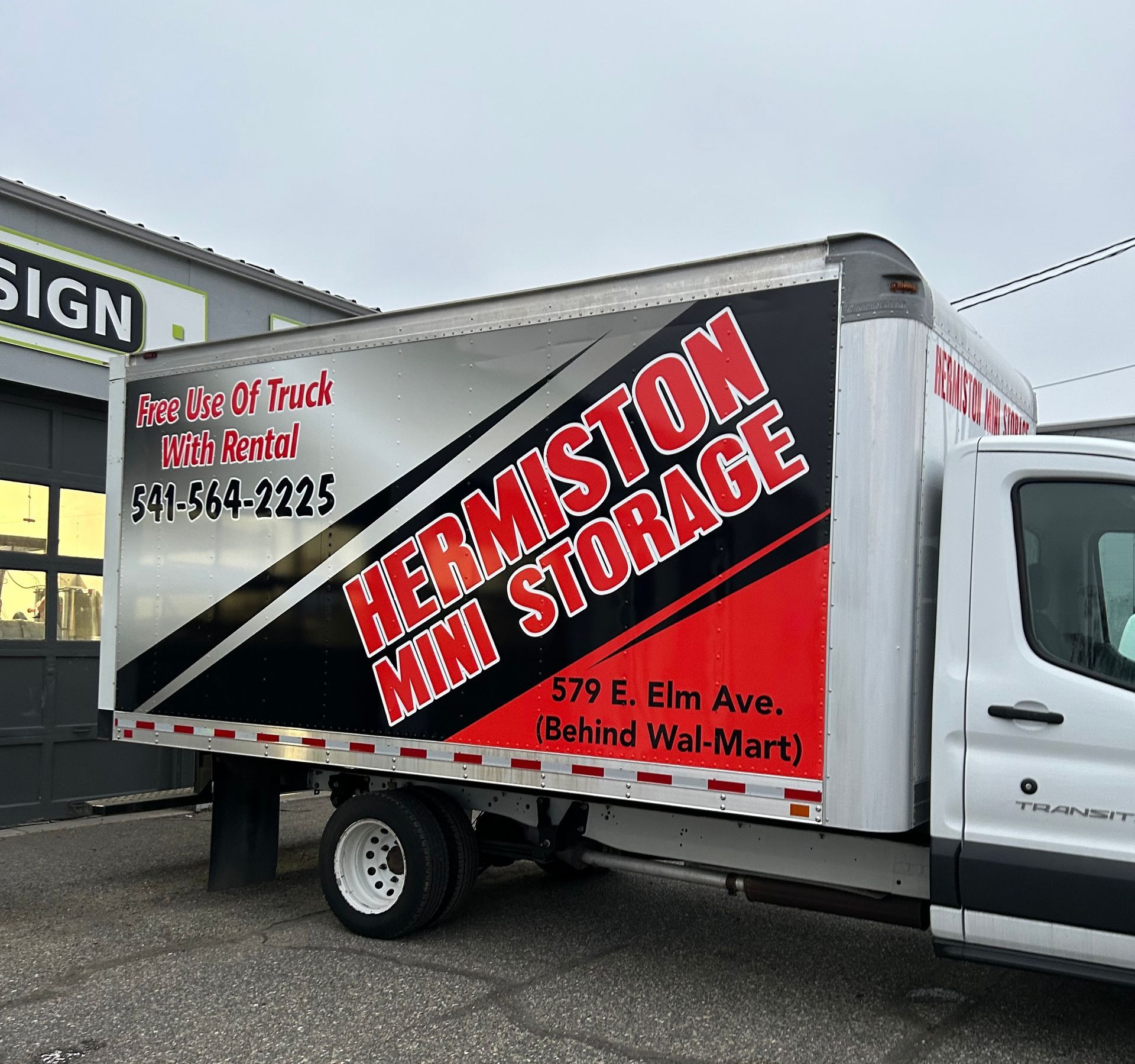 Hermiston Mini Storage box truck with advertising: name, phone, and address (behind Wal-Mart).