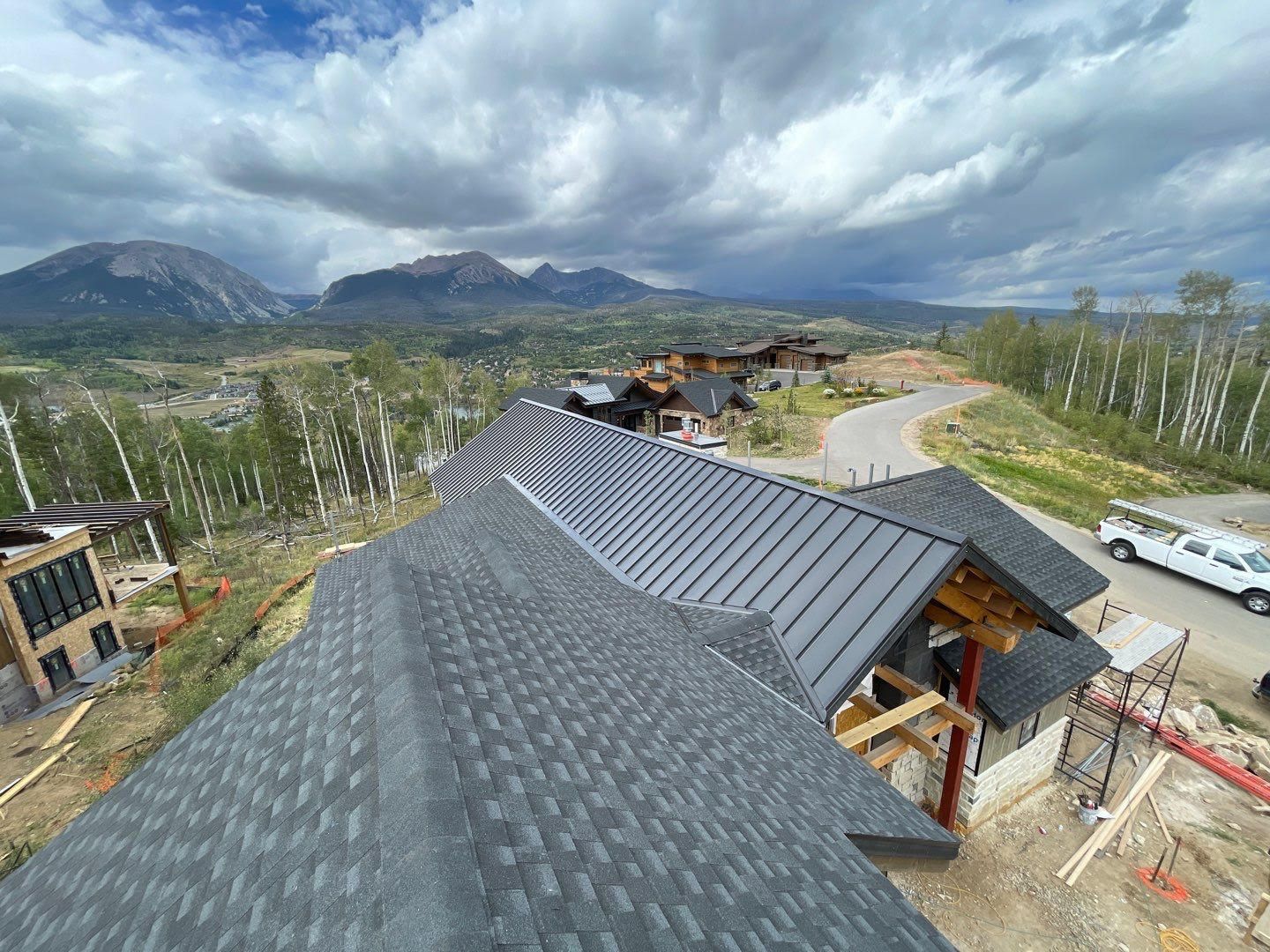 Metal and asphalt shingle residential roof installation in Breckenridge, CO