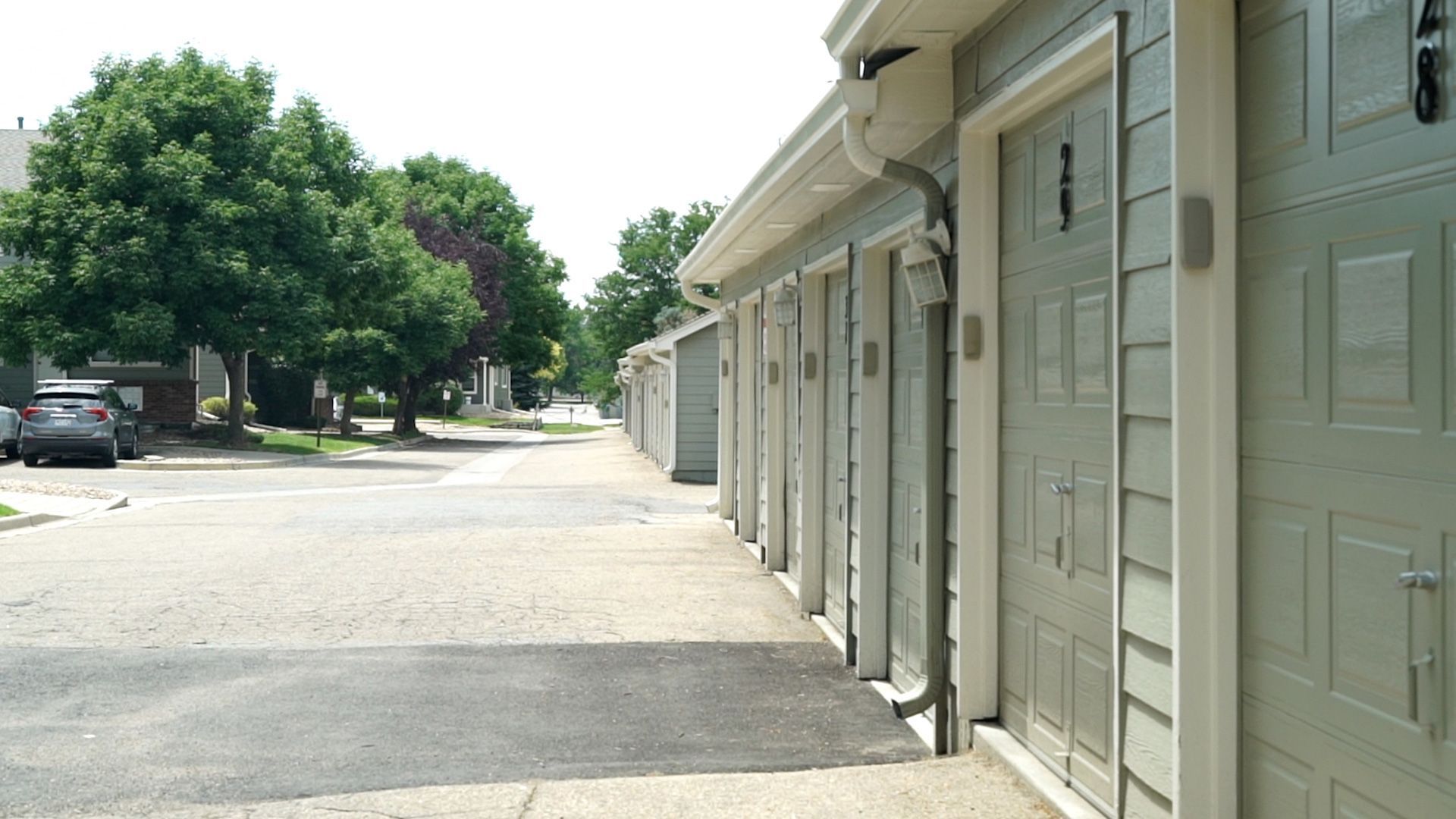 Commercial siding and garage door installation at Villas at Park Crest in Longmont, CO by CCG Roofing & Project Management