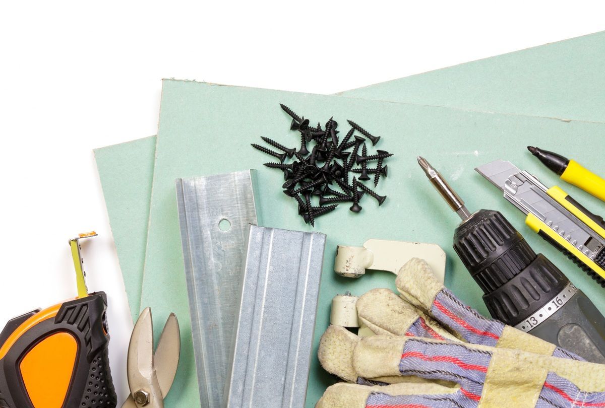 Professional drywall tools prepared for a wall repair project