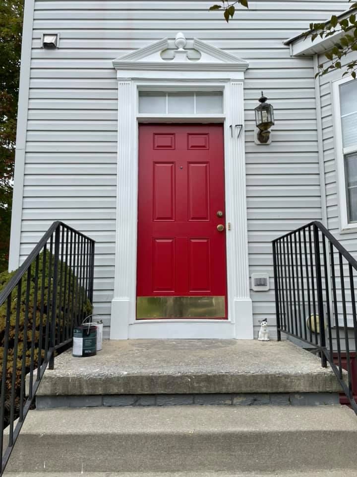 A red door with the number 17 on it