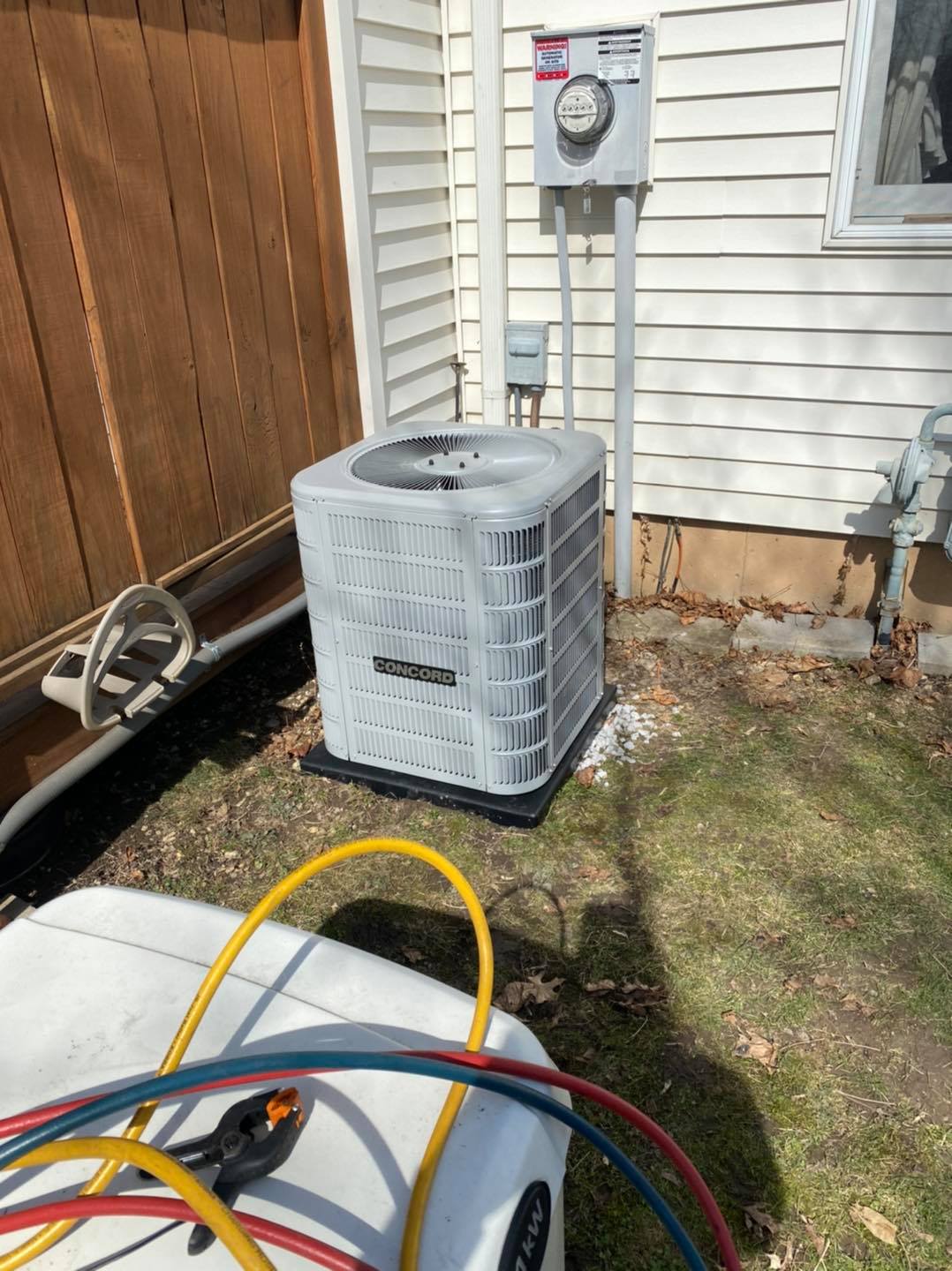 Air Conditioning Beside the Wall — Akron, NY — Comfort Zone Heating & Cooling