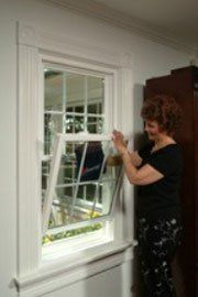 Woman Opening Window — Ashtabula, OH — Weather Sealco (W.S.A Inc.)