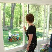Woman Opening Sliding Window — Ashtabula, OH — Weather Sealco (W.S.A Inc.)