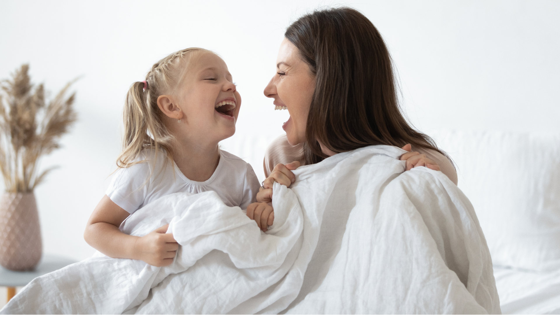 Mother sharing happy moments, feeling healthy and present after her OB GYN visit at Allmed LA. 