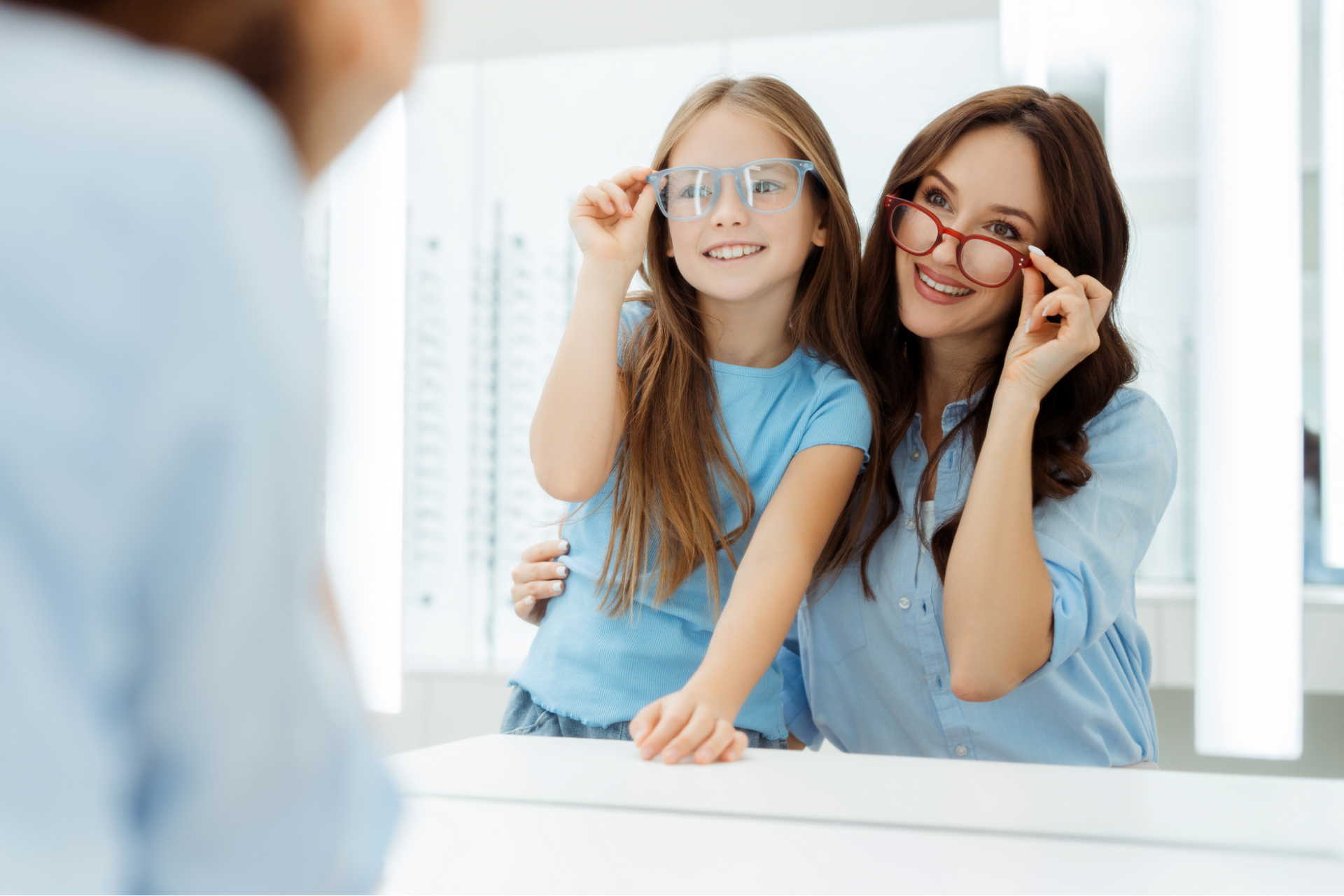 Mother and child receive prescription eyeglasses from Allmed LA after a comprehensive eye exam