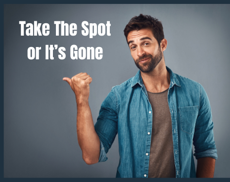 Man in denim shirt points left, with text