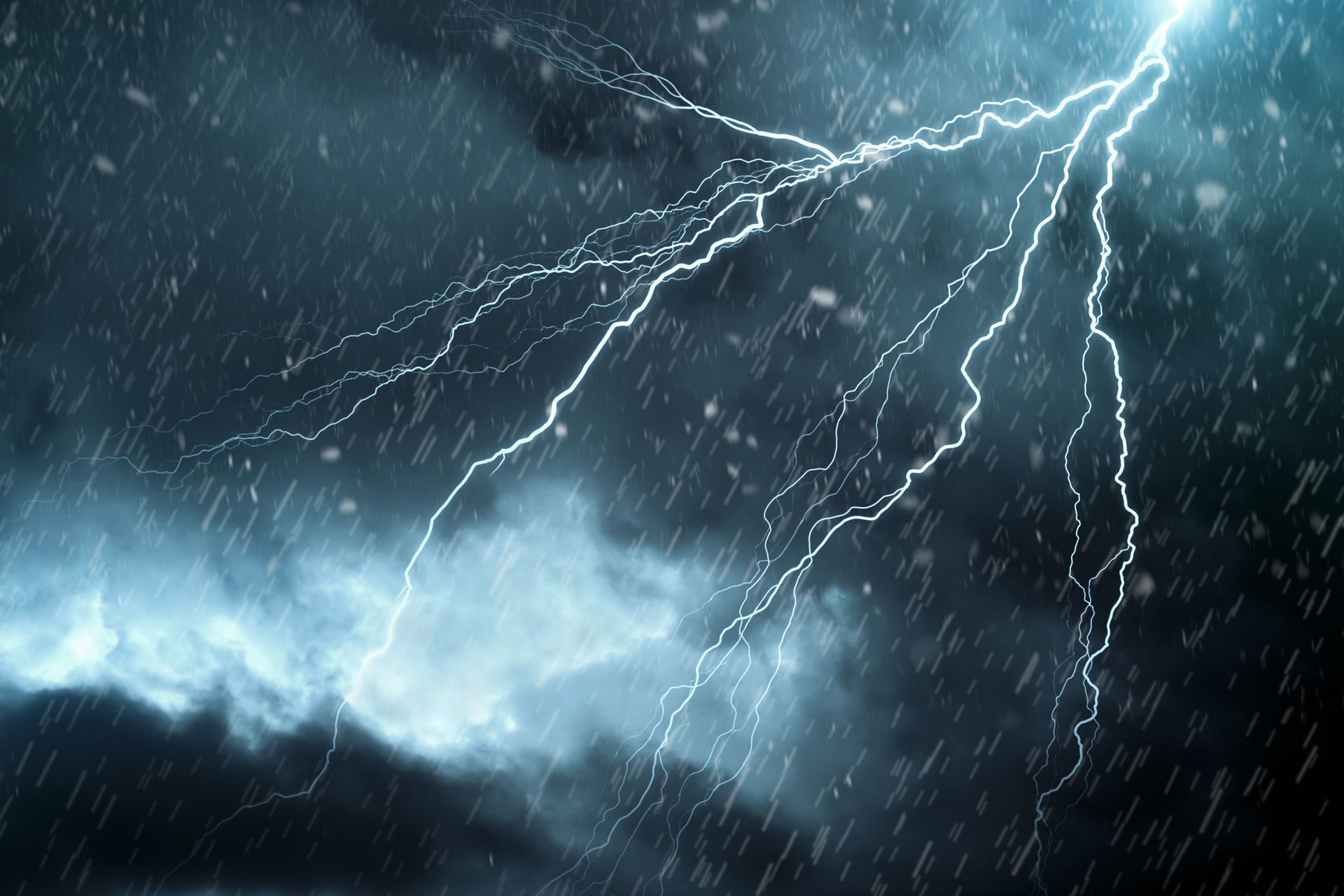 There is a lot of lightning in the sky in the rain.