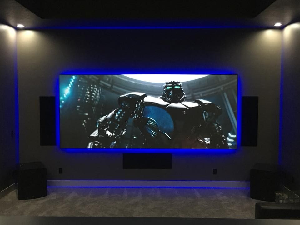 Home theater with large screen displaying robot from 