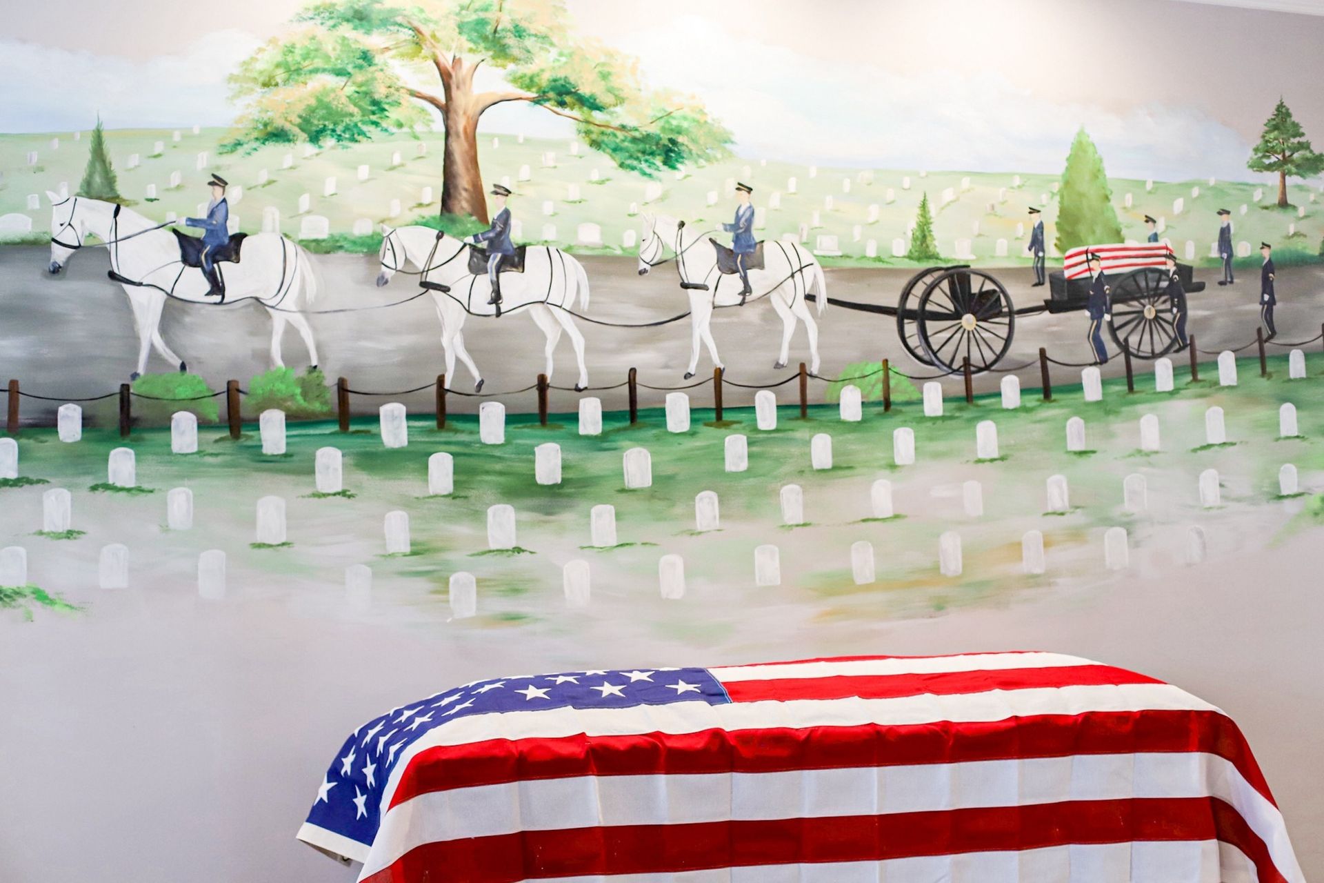 American flag draped coffin, painting of military funeral procession in cemetery.