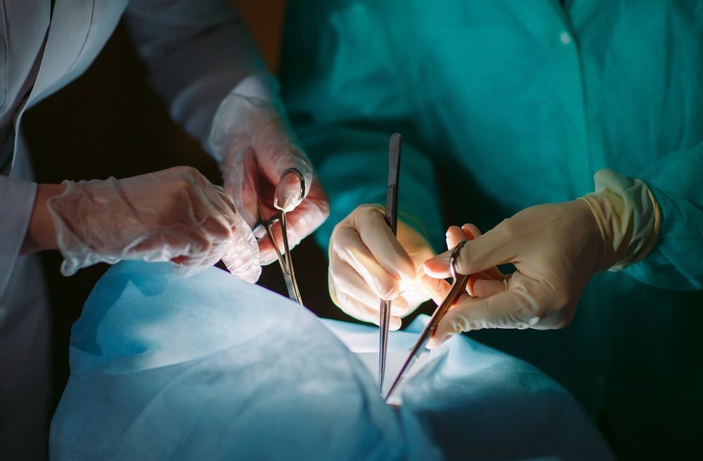 Two Surgeons are Operating on a Patient in an Operating Room — Brisbane Upper GI Surgery in Chermside, QLD