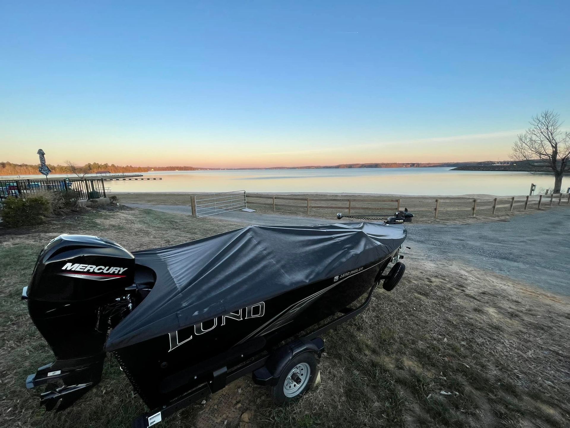 boat sitting next to lake