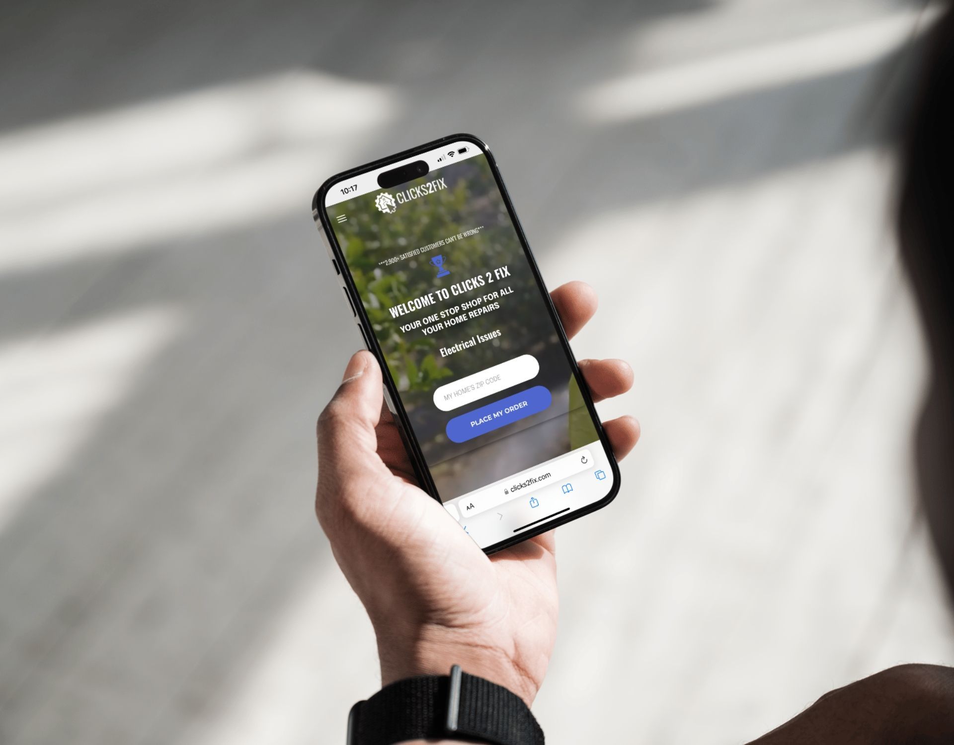 A person is holding a cell phone in their hand.