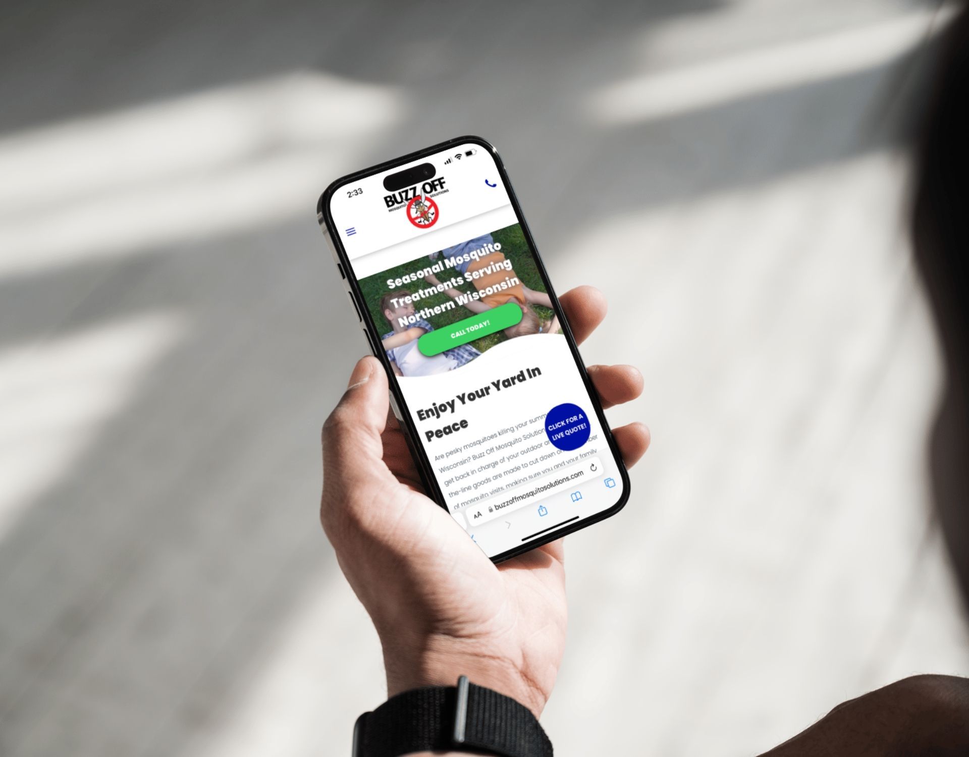 A person is holding a cell phone in their hand.