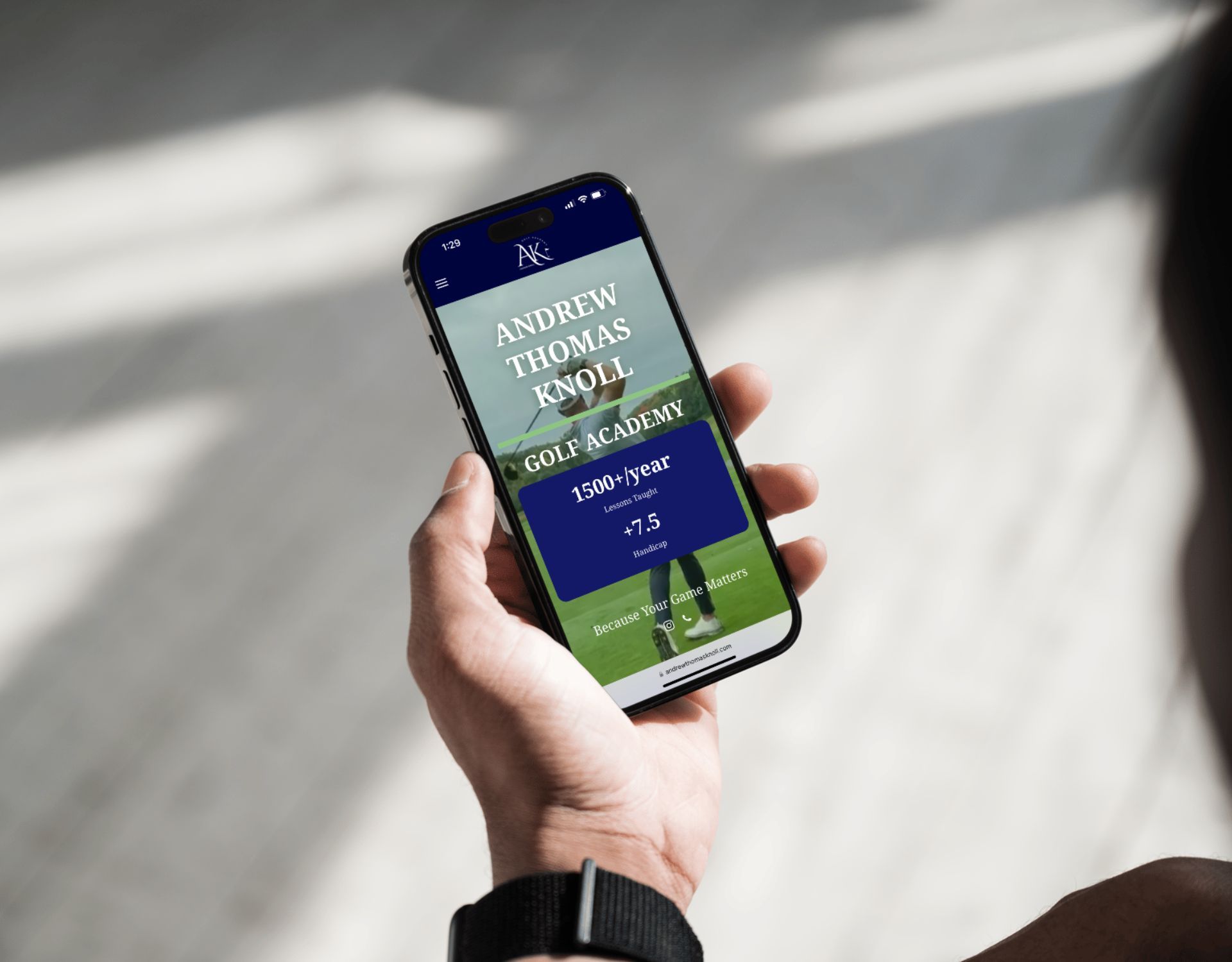 A person is holding a cell phone in their hand.
