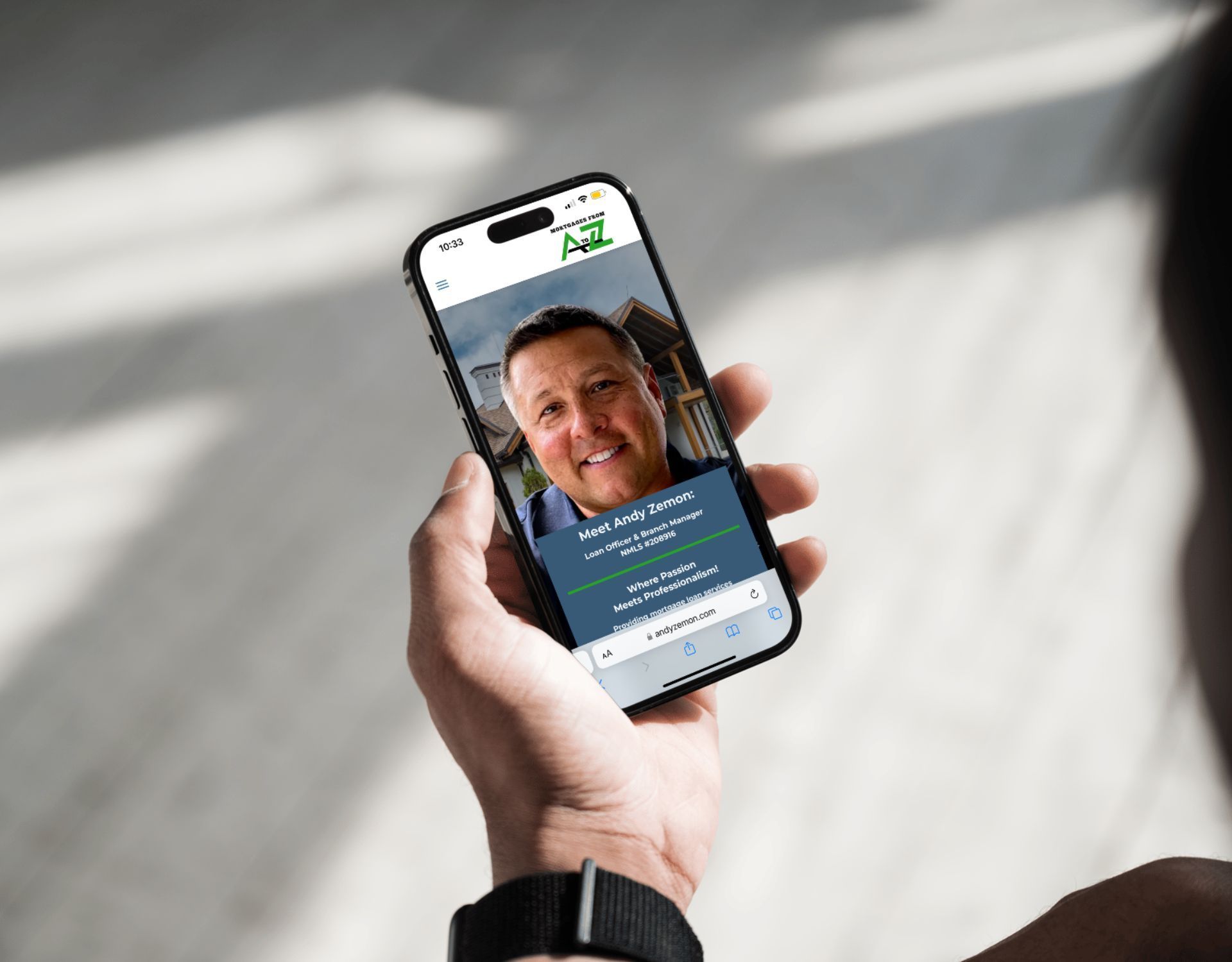 A person is holding a cell phone in their hand.