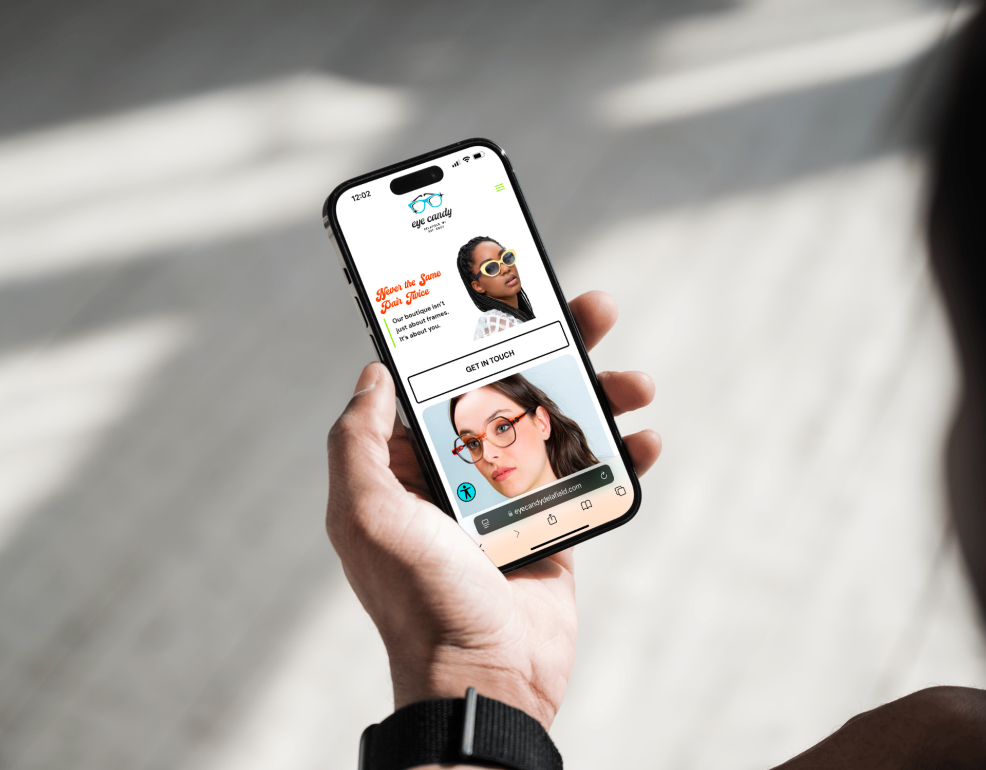 A person is holding a cell phone in their hand.