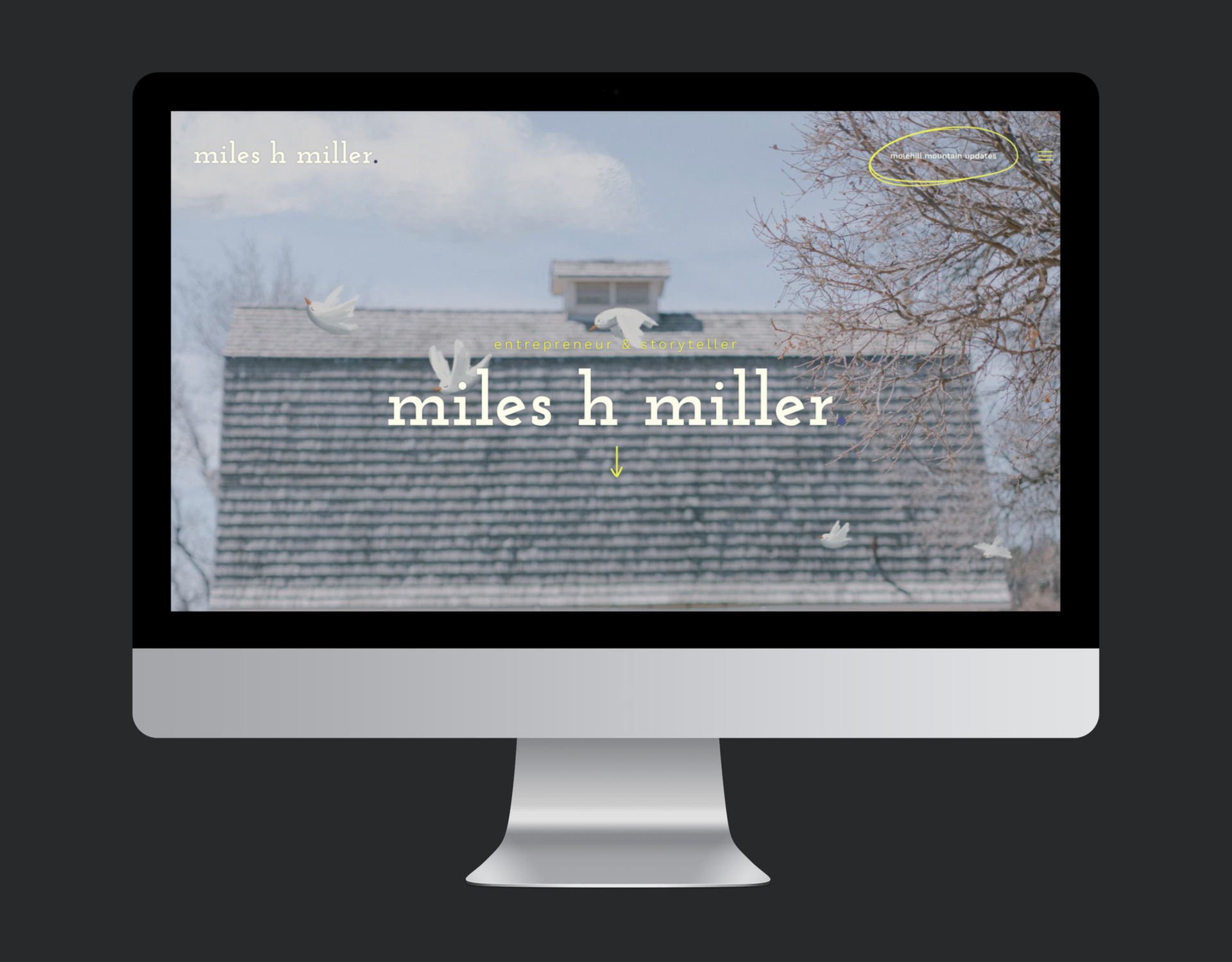 A computer monitor displaying a website for miles h miller