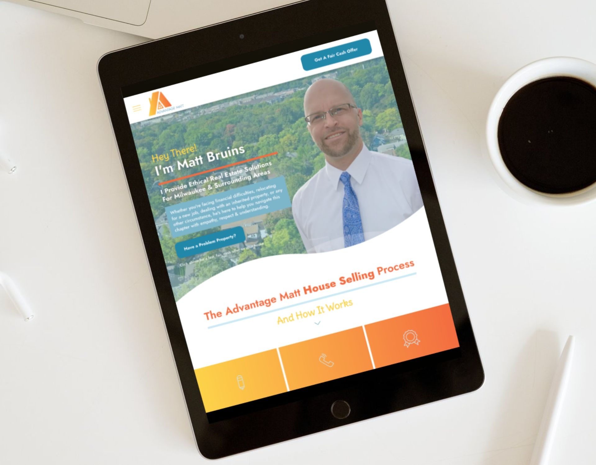 A tablet with a man on the screen is sitting on a table next to a cup of coffee.