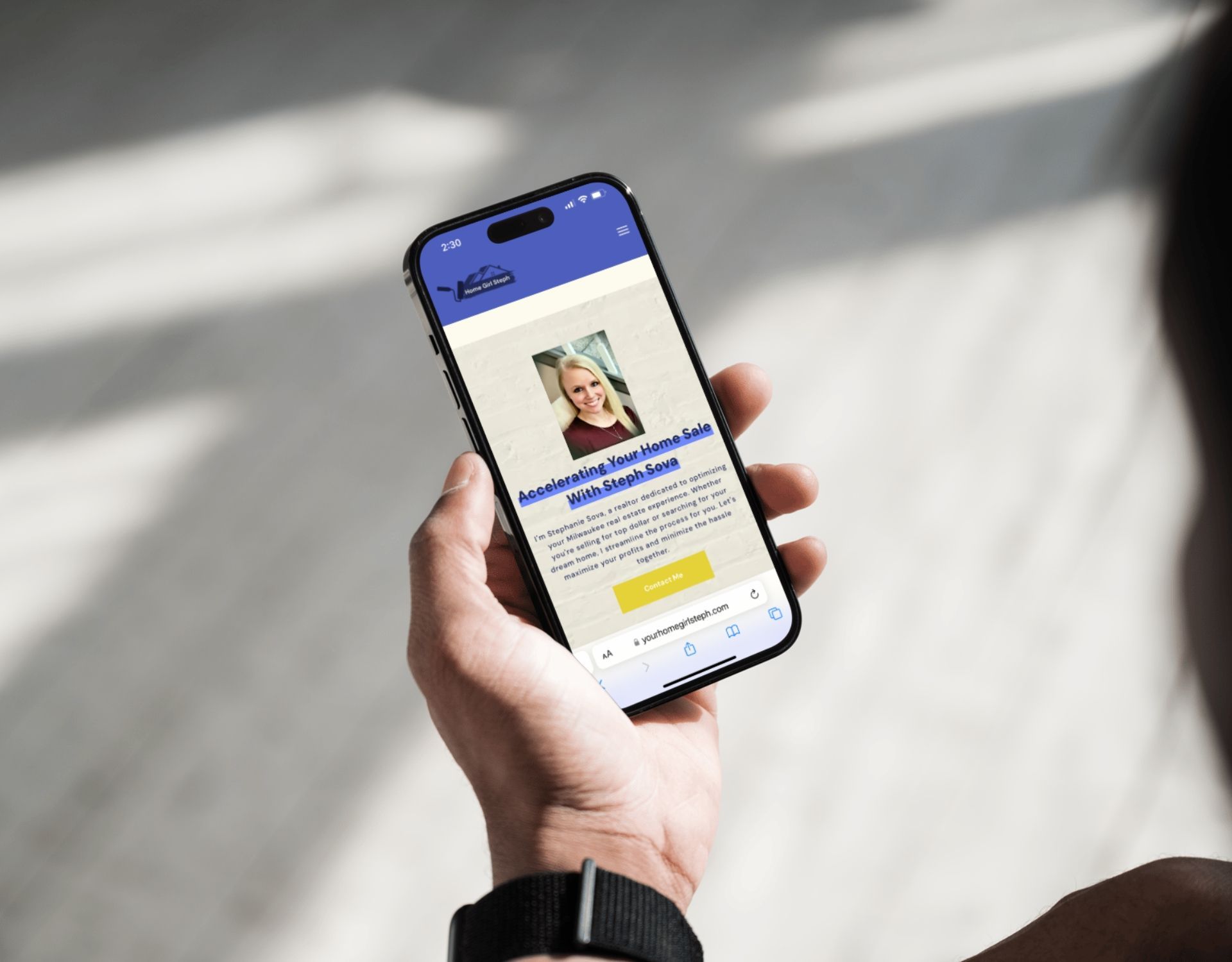 A person is holding a cell phone in their hand.