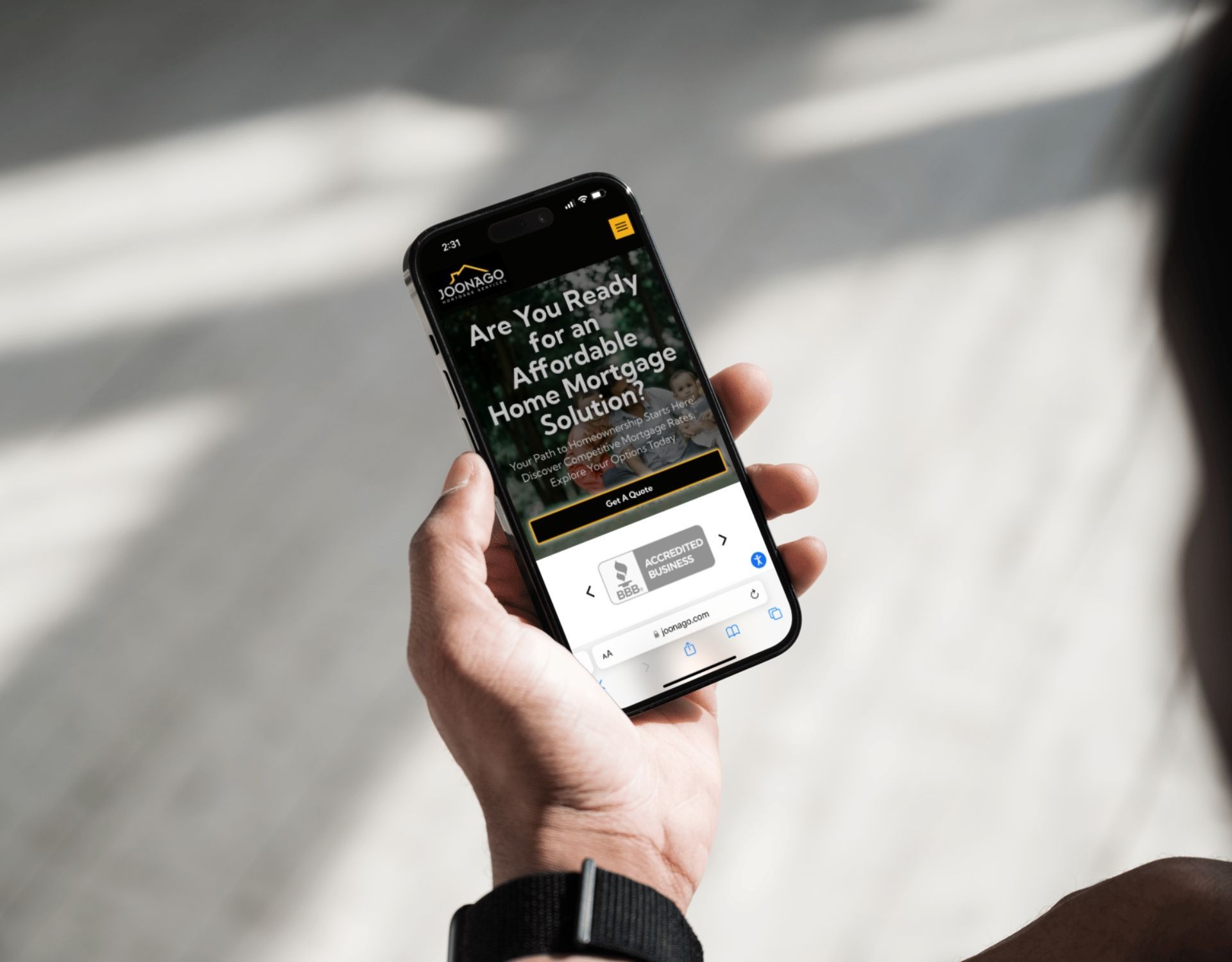 A person is holding a cell phone in their hand.