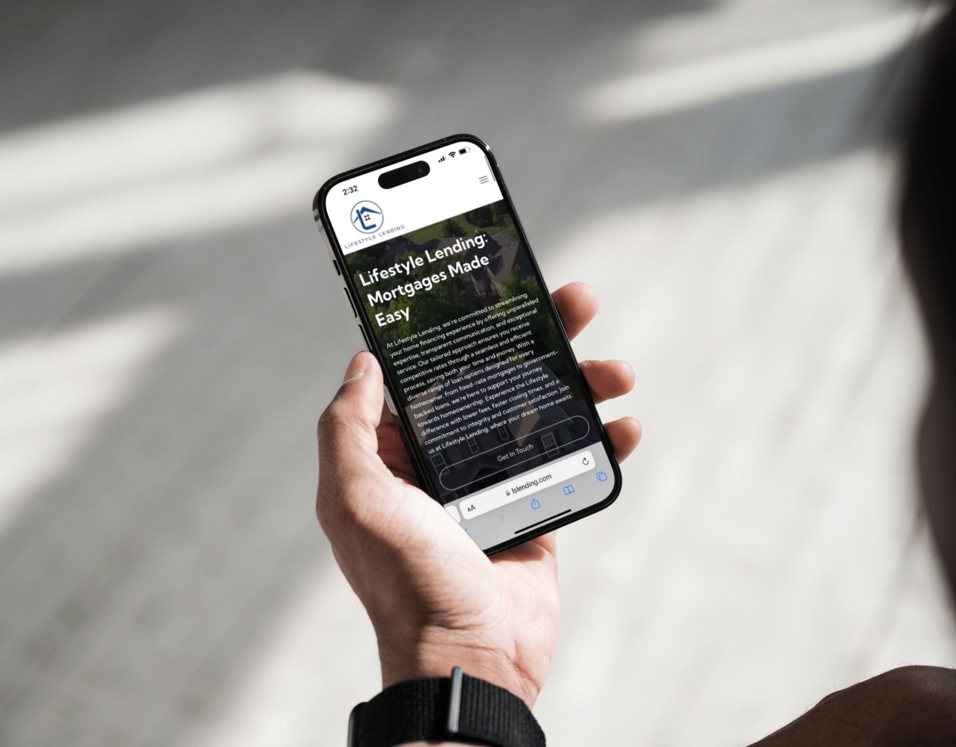 A person is holding a cell phone in their hand.