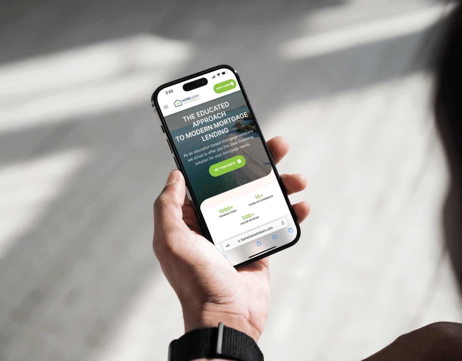 A person is holding a cell phone in their hand.