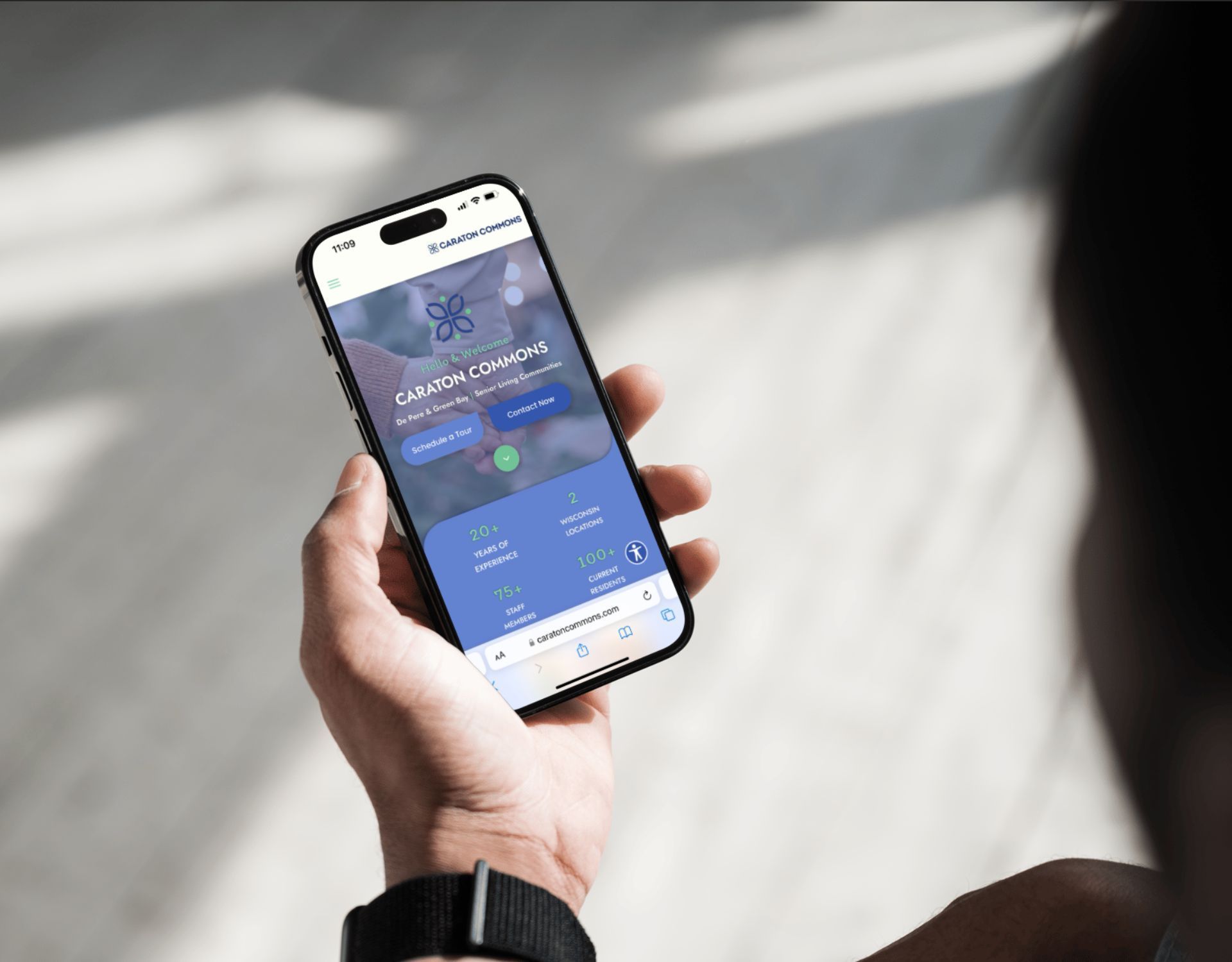 A person is holding a cell phone in their hand.