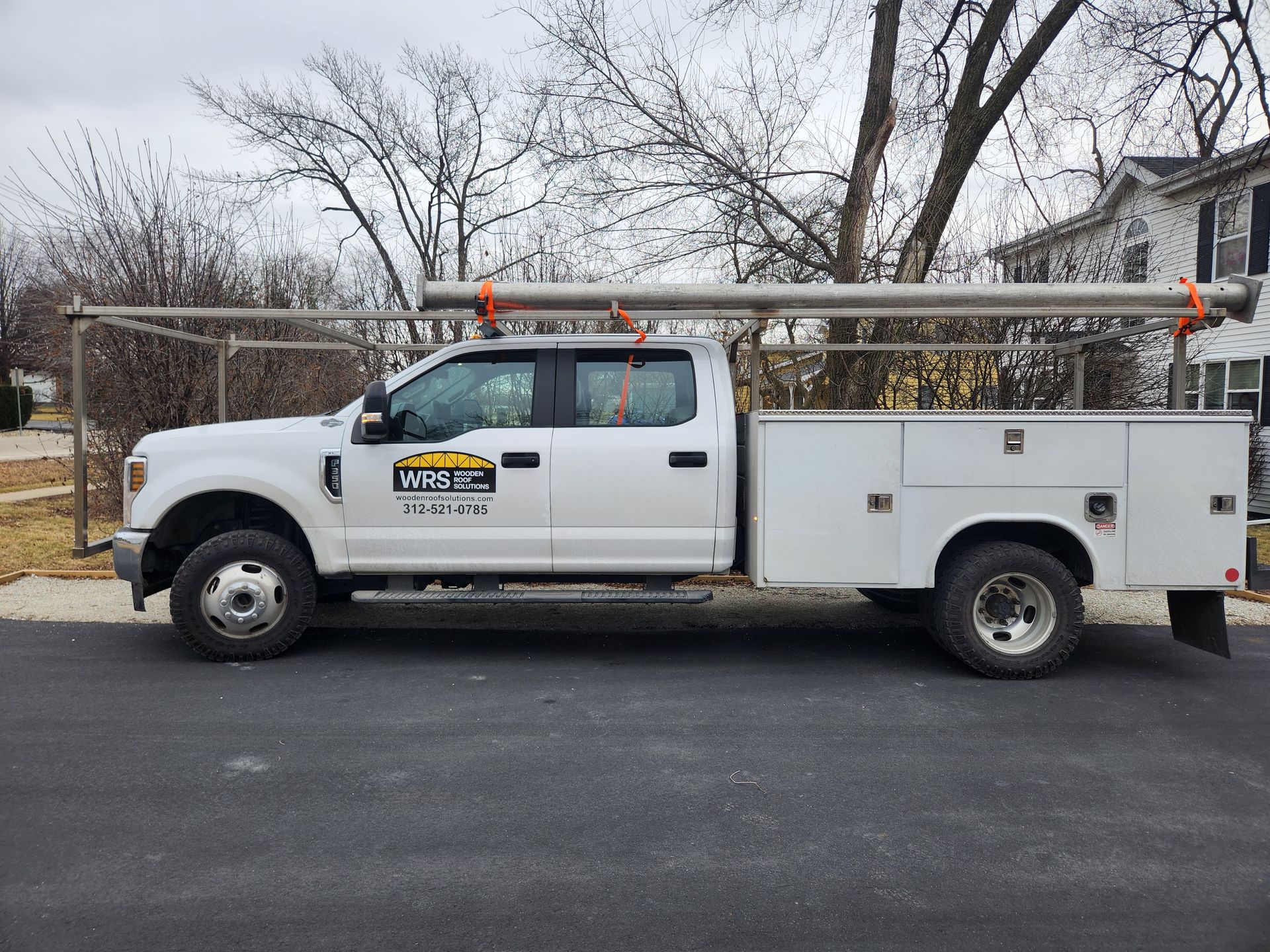 Wooden Roof Solutions work truck transporting materials in Oshkosh & Milwaukee area