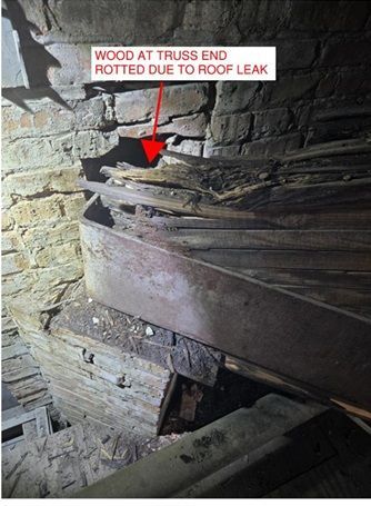 Damaged wooden roof truss showing structural deterioration during inspection in Oshkosh & Milwaukee