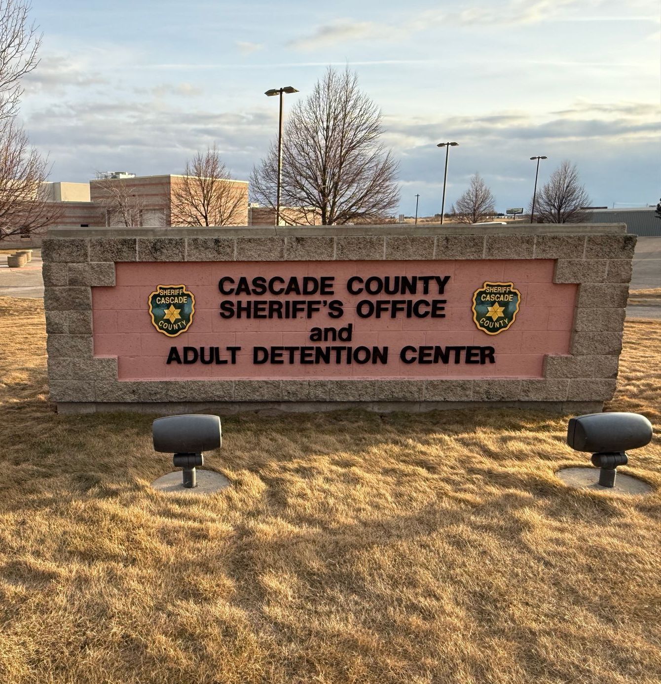 A sign for cascade county sheriff 's office and adult detention center