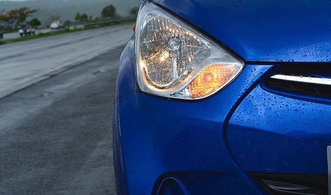 close up of blue car with auto insurance