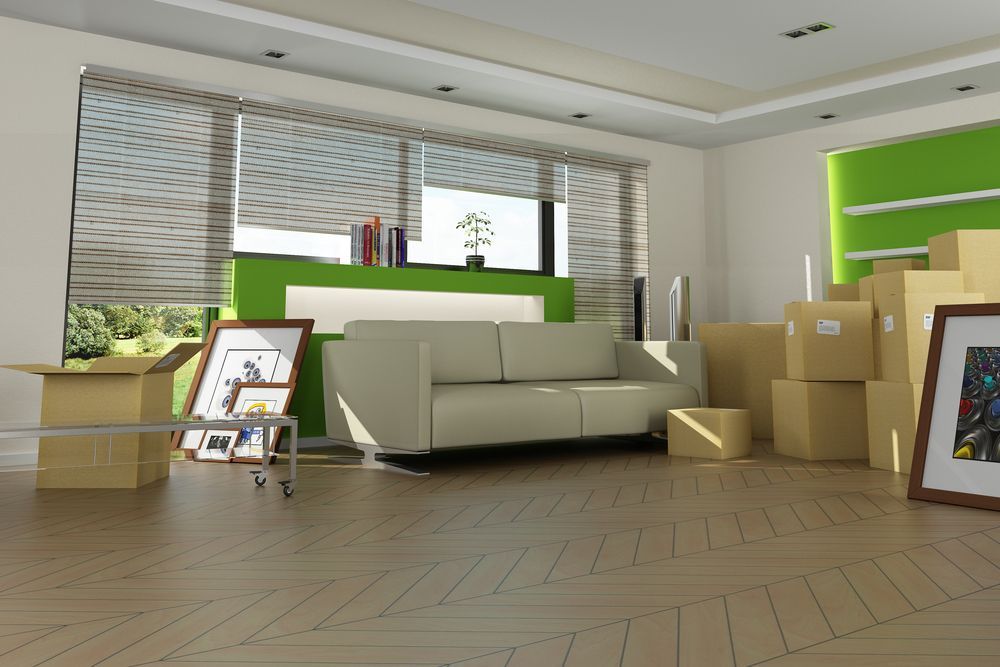 A Living Room Filled With Boxes and a Couch — FNQ Furniture Removals in Mareeba, QLD