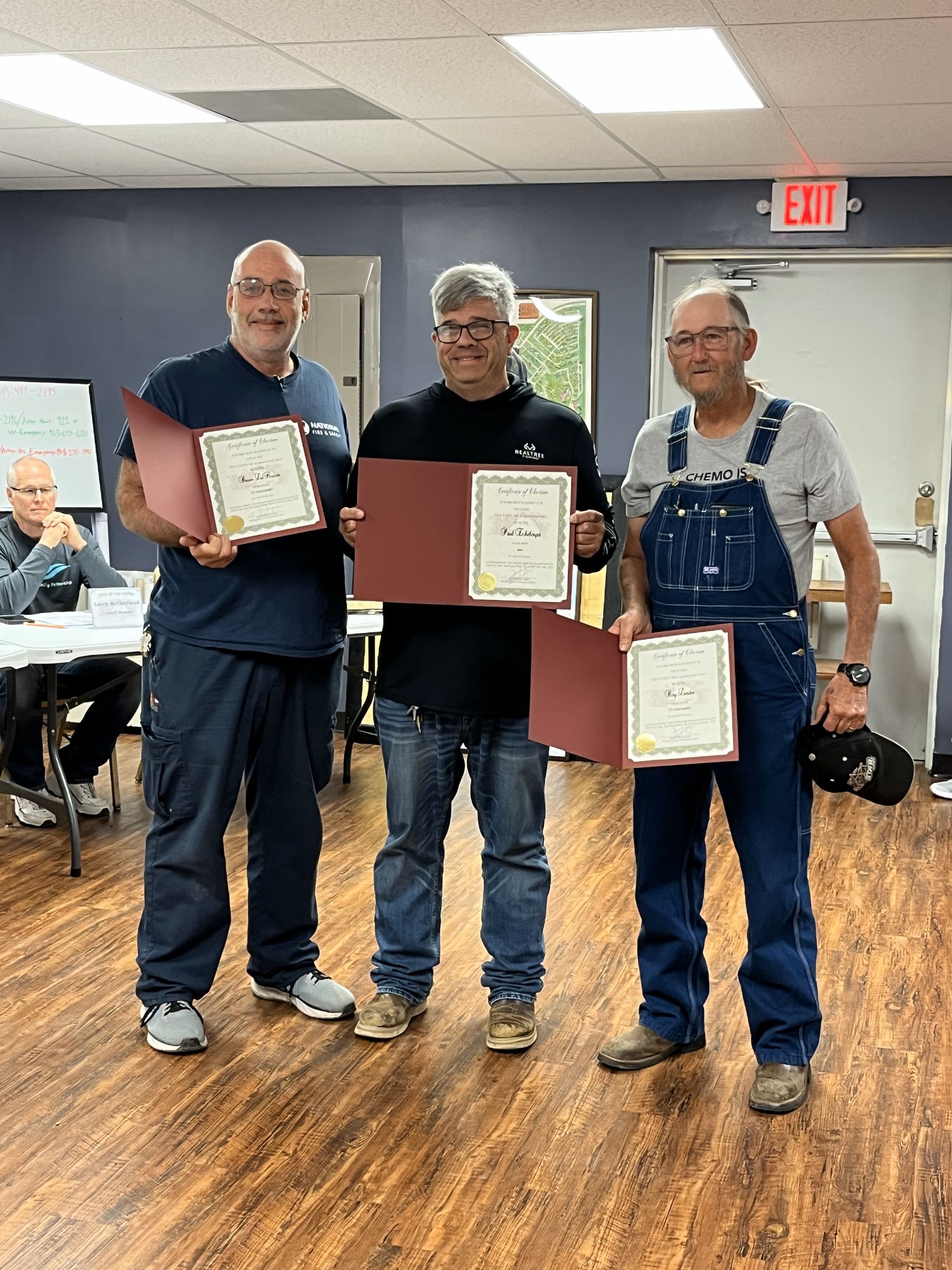 Left to Right: Newly elected officials, Brian LaFlower (Councilmember), Paul Eckeberger (Mayor), and Roy Linder (Councilmember) accept their Certificates of Election. 