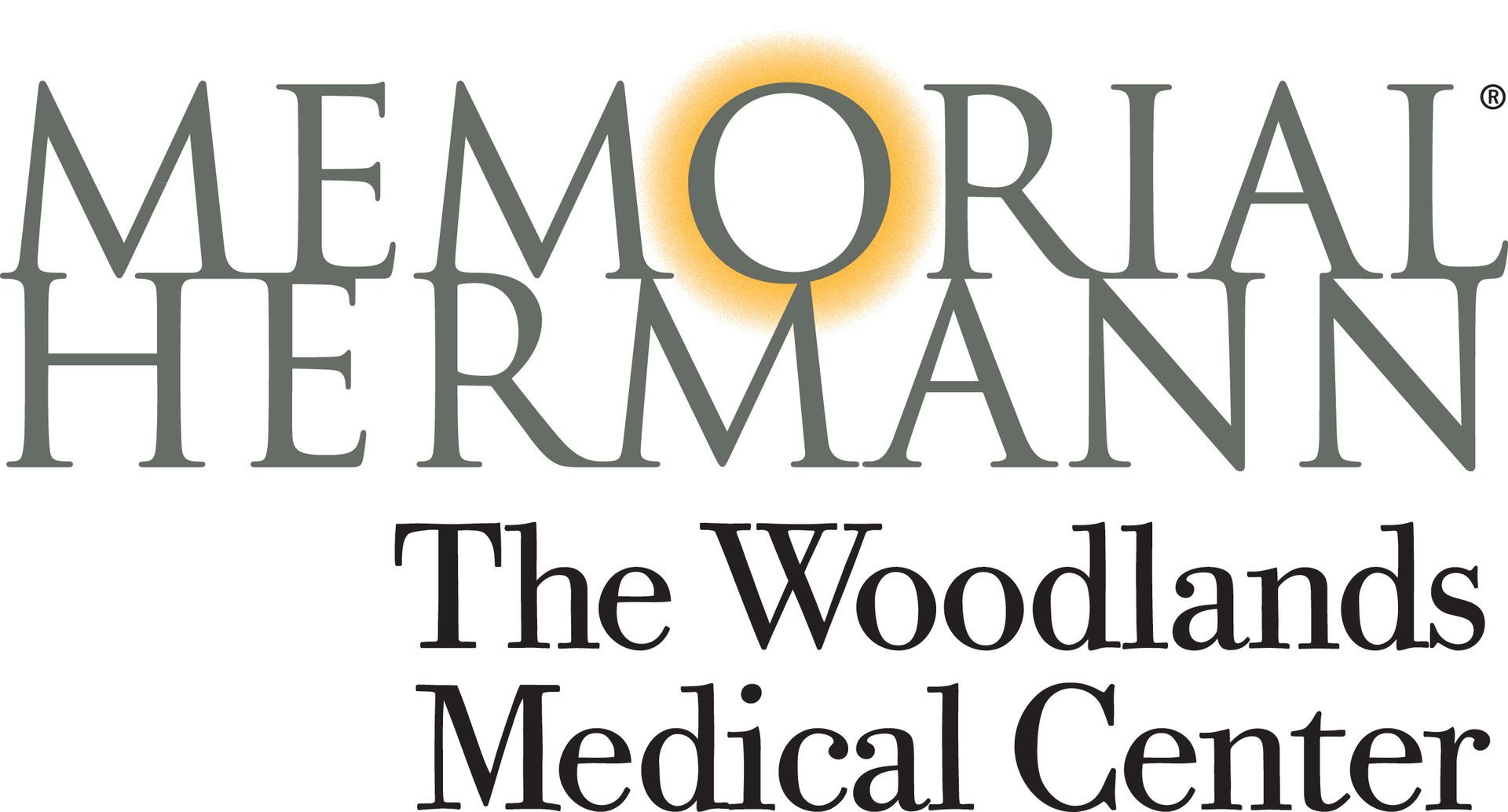 Memorial Hermann The Woodlands Medical Center logo in gray and gold text