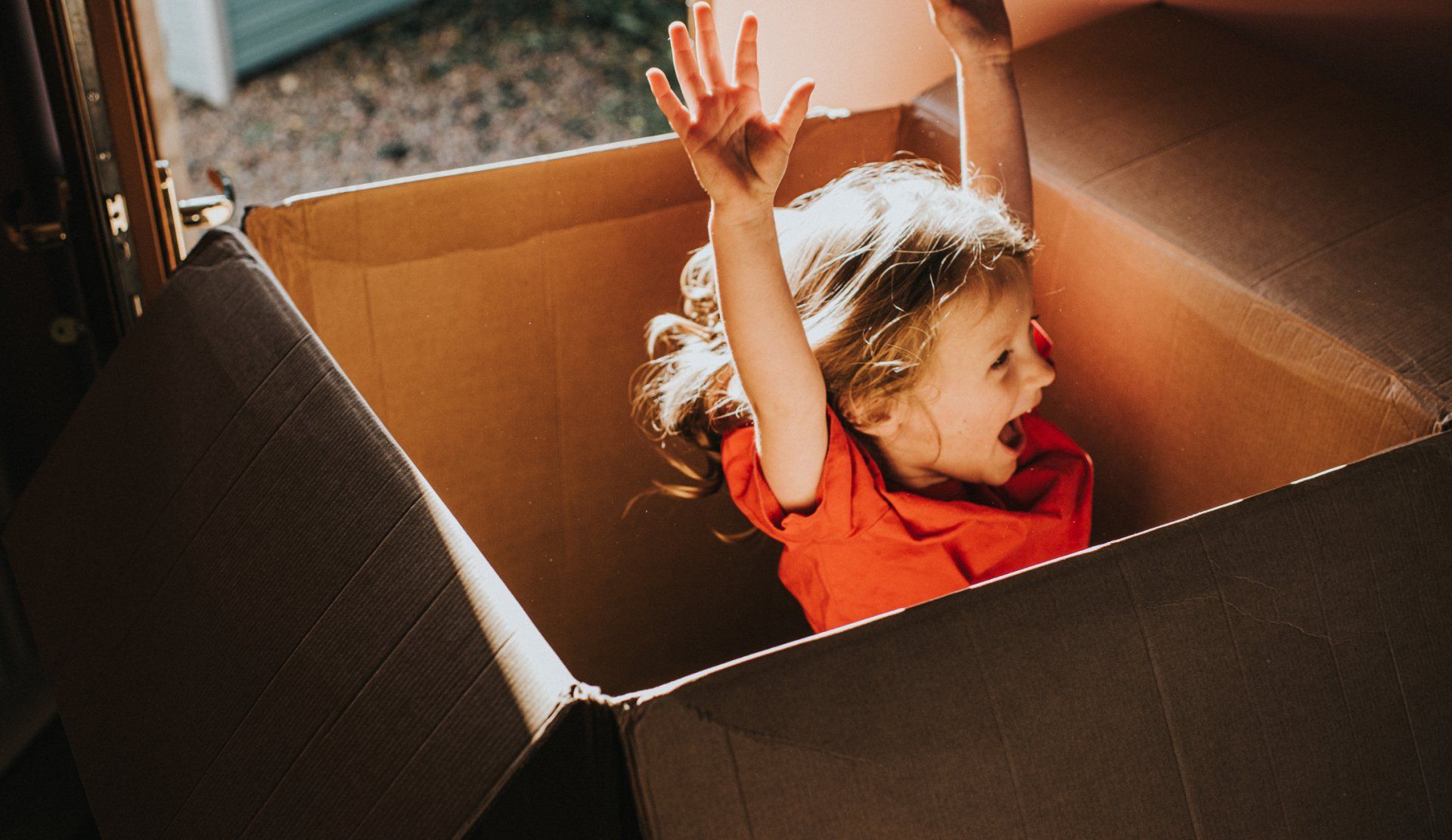 Happy Kid Inside the Box — Rochester, NH — Peterson Movers Happy Kid Inside the Box — Rochester, NH — Peterson Movers