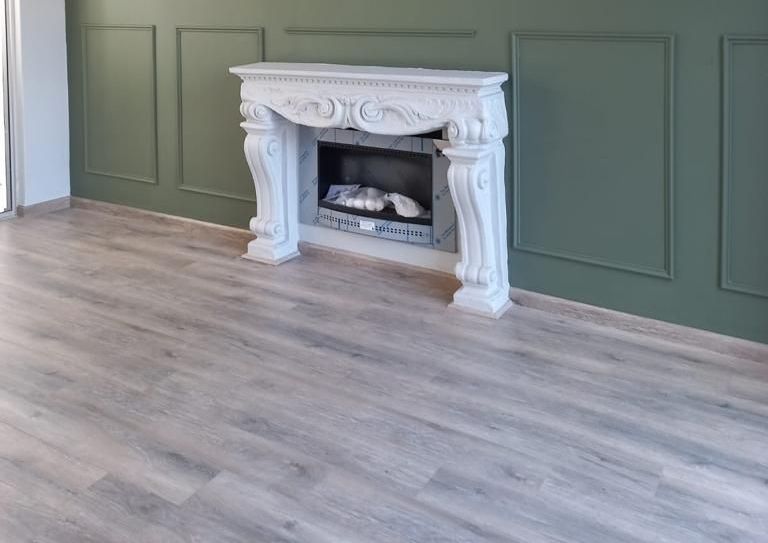 there is a fireplace in the middle of the room .