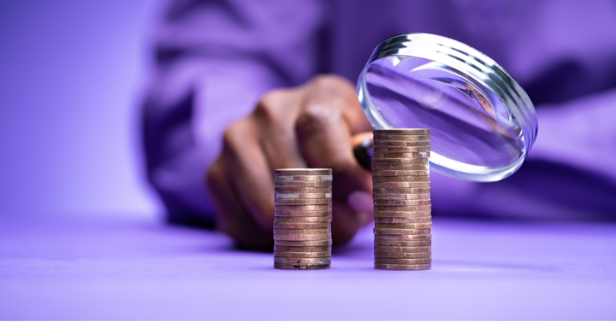 two piles of coins to represent values us bigger than a salary survey