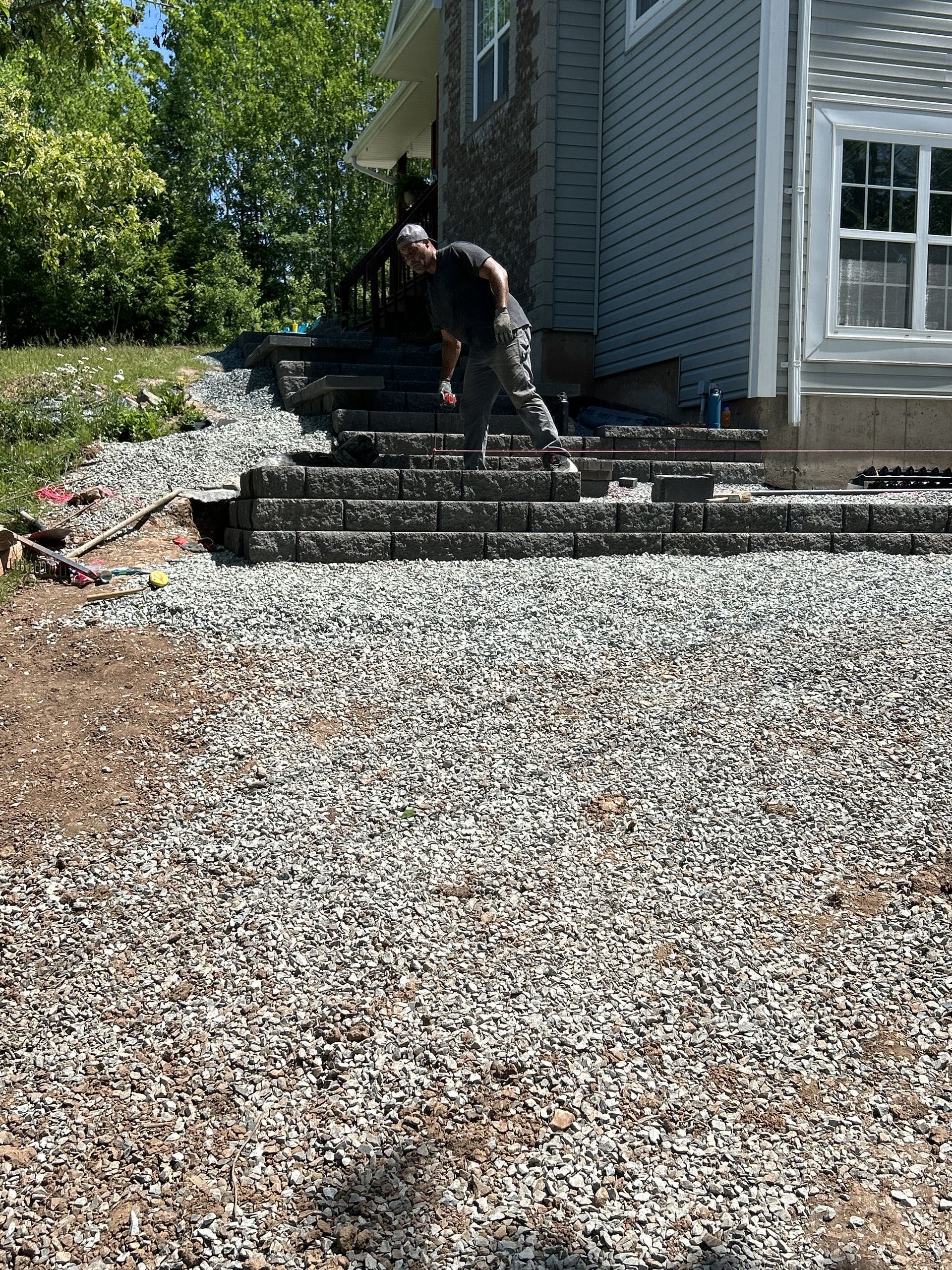 Gravel base installation and compaction for a Halifax paver patio